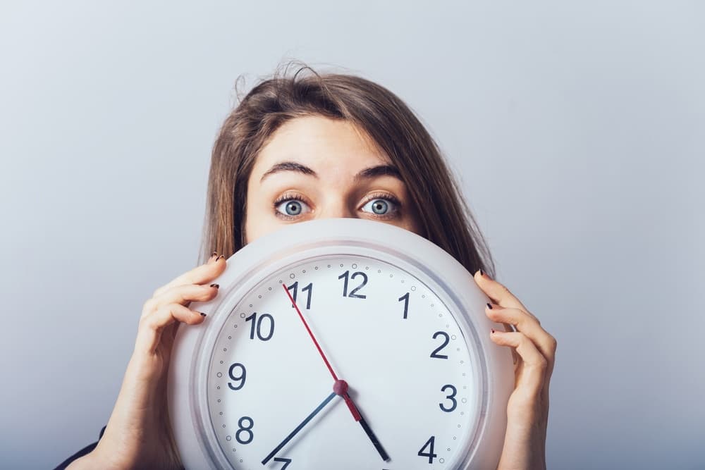 a girl with a clock