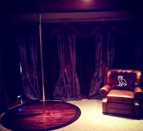 private back room at strip club, with arm chair a dancing pole and velvet curtains