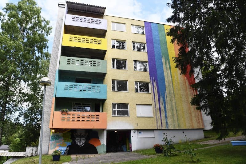colorful balconies and walls on the side of a condemned building