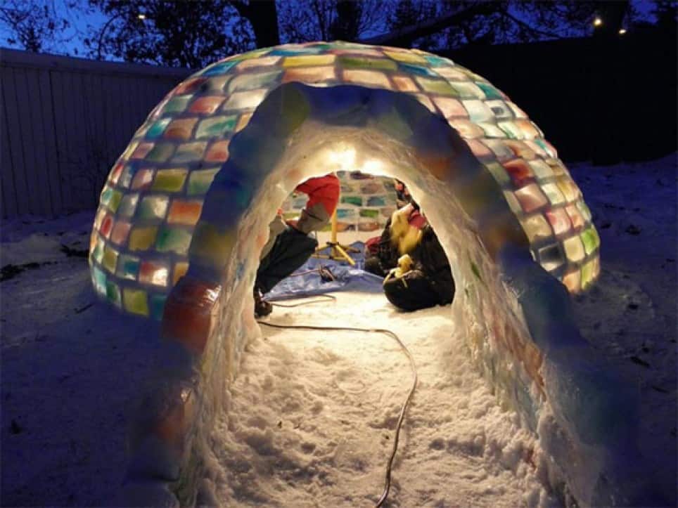 couple having a date insade an igloo in their backyard