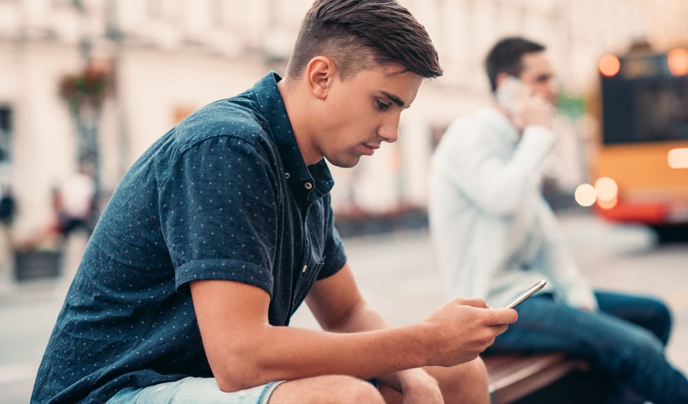 man texting