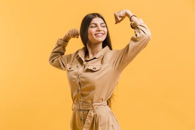 strong woman in nice clothes flexing her arms