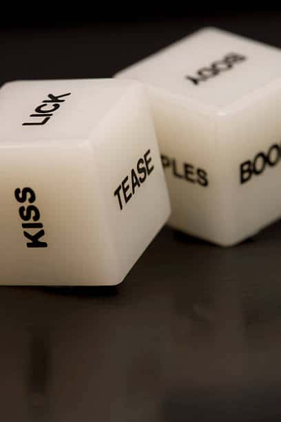 sexy couples game dice with sides that say, kiss, lick, tease, boobs, body, etc