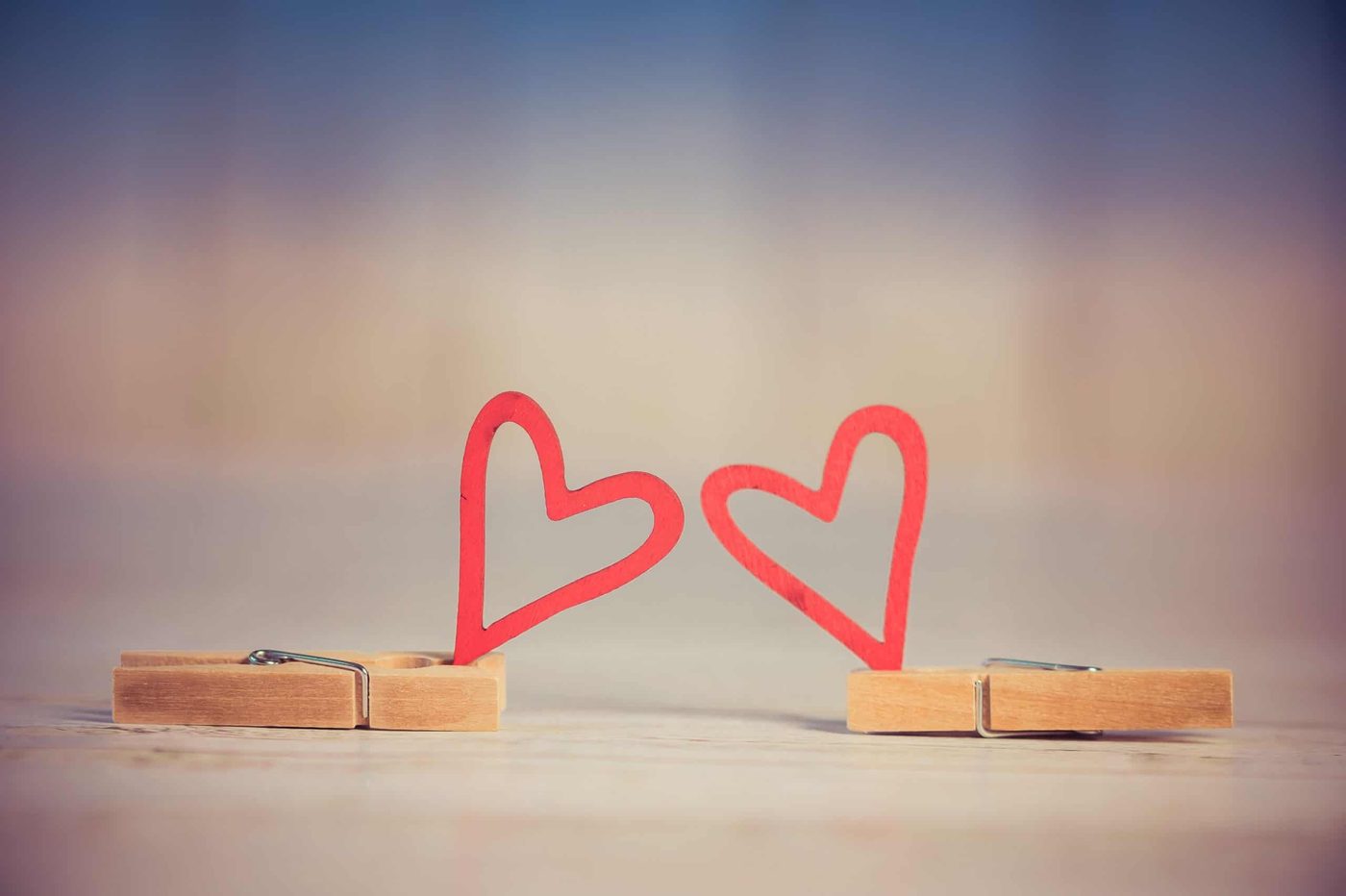 paper clips holding paper hearts