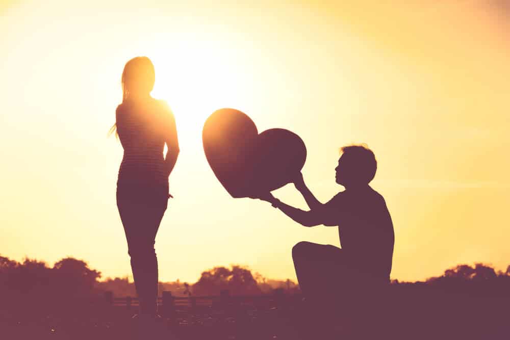 man chasing a woman professing his love