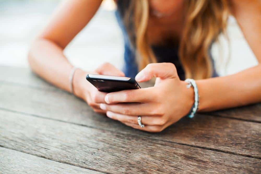 woman texting over phone