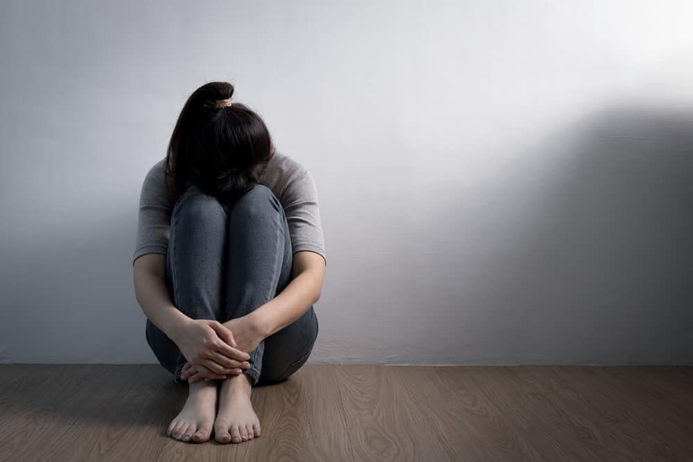 woman sitting sad