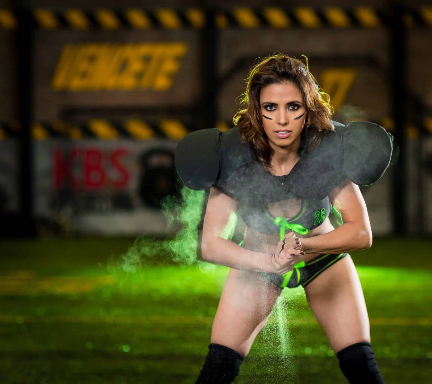 woman wearing football pads and sporty underwear