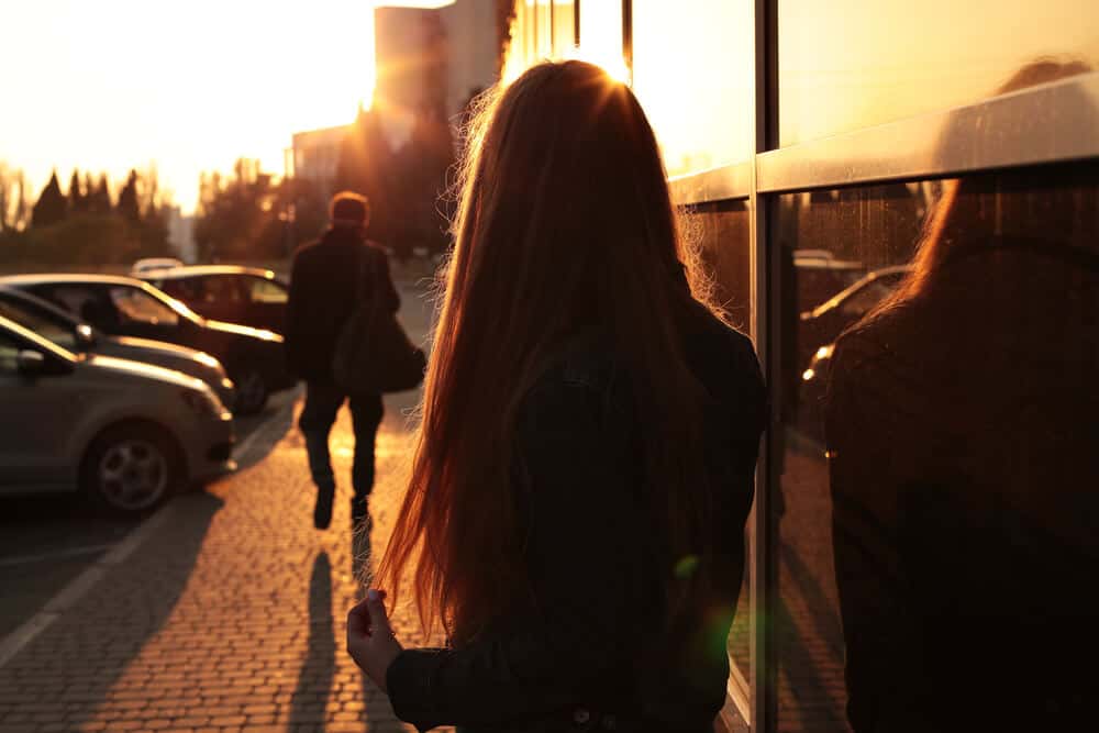 man walking away from a woman