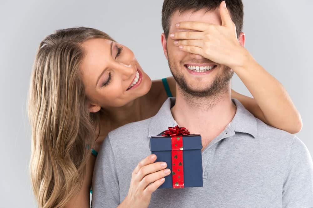 Woman surprises man with a birthday gift