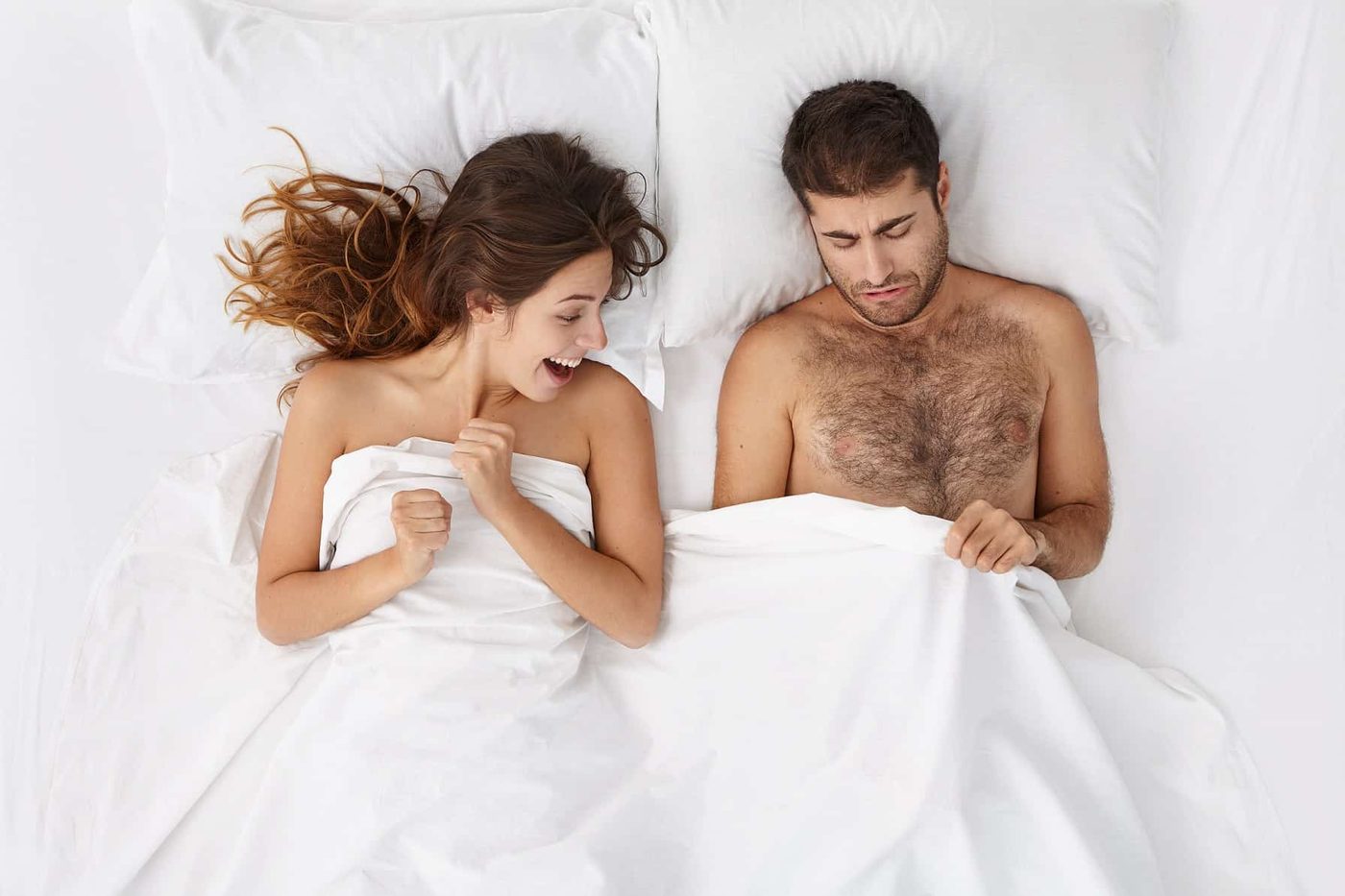 man woman bed blanket peeping