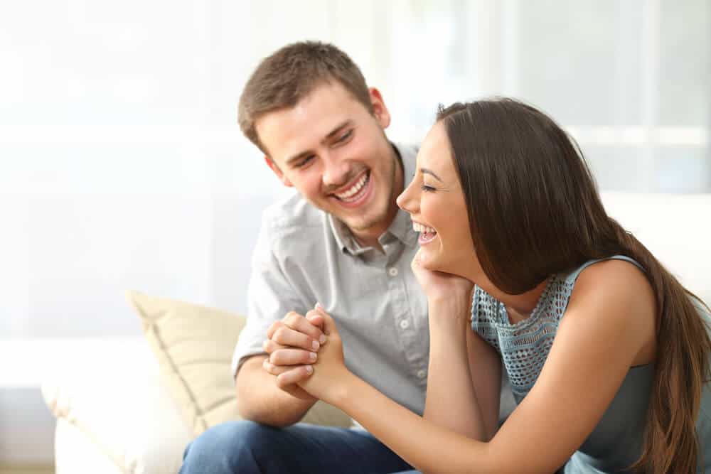 man and woman laughing