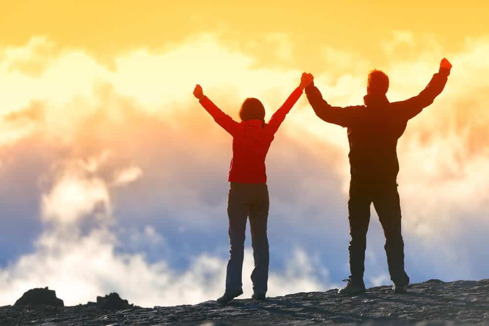 couple victory on mountain