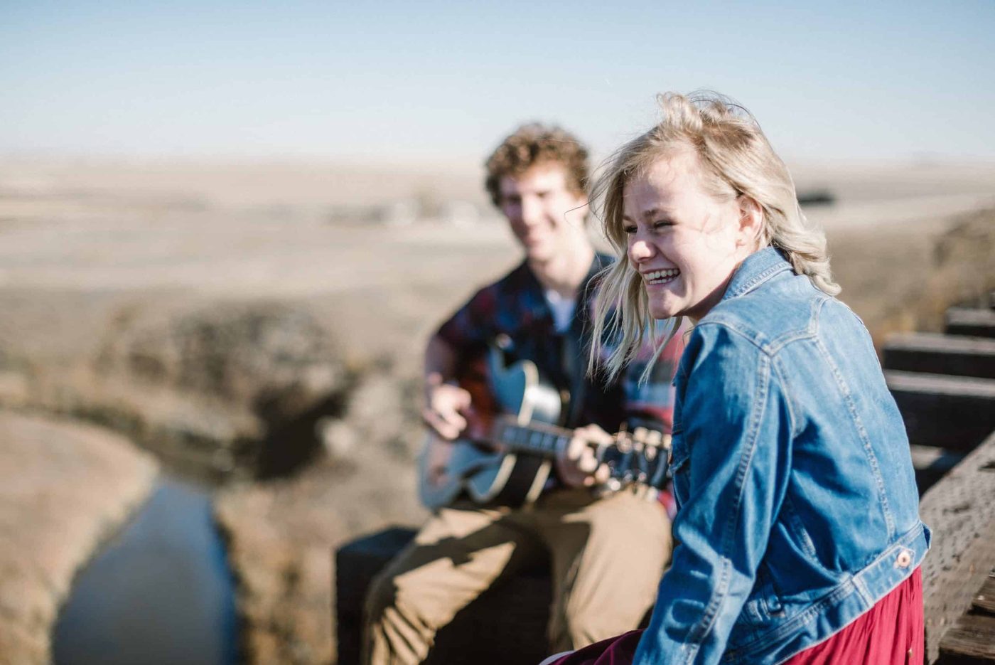 man and woman laughing