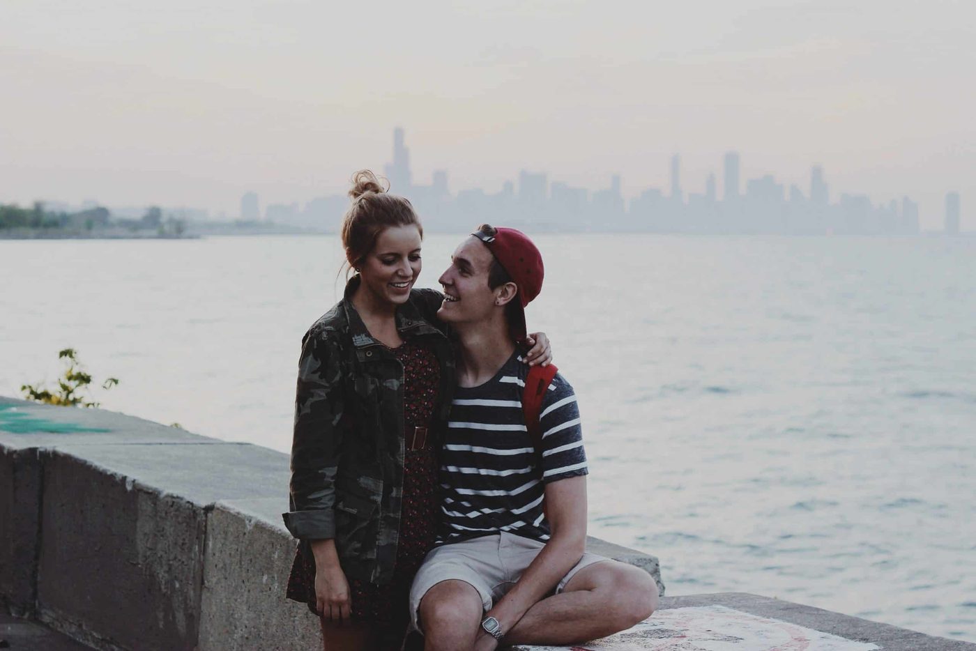 smiling couple ocean city background