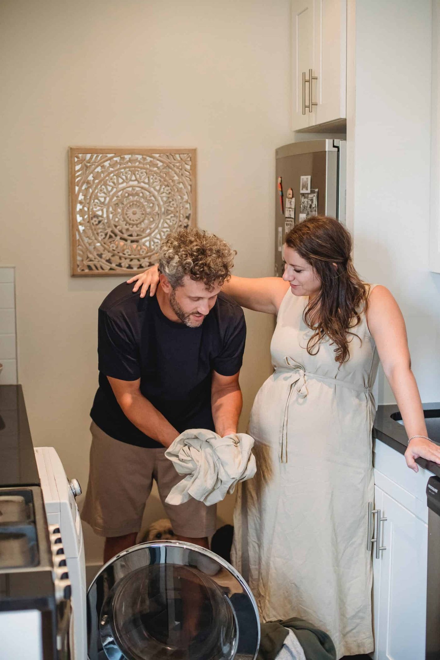 Woman and her husband doing laundry together