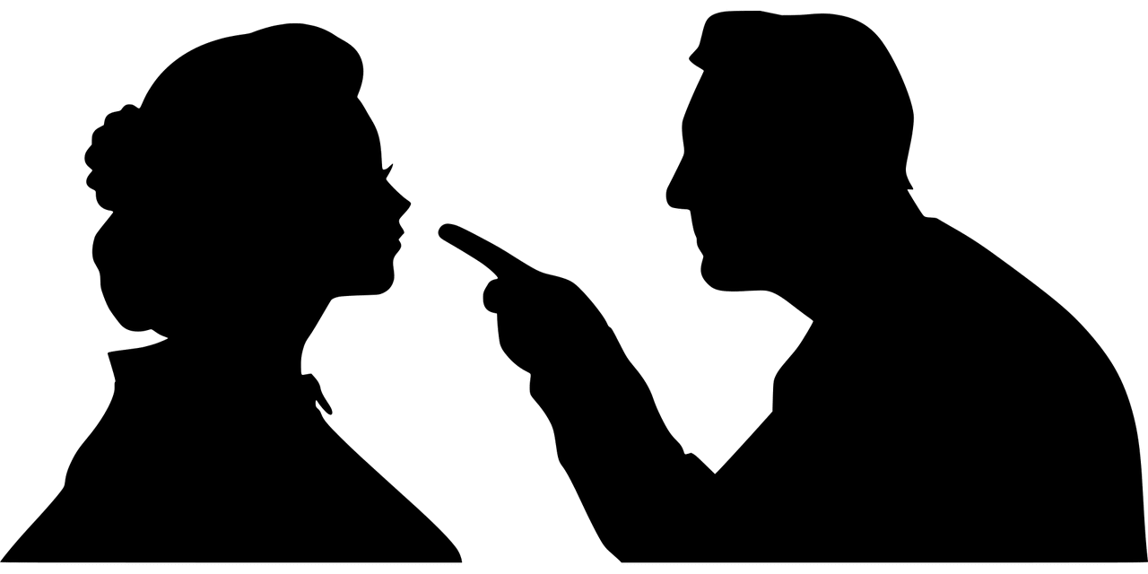 silhouette of angry man pointing blame at woman