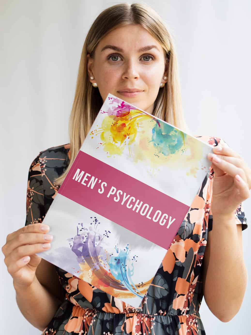 Woman holding 'Men's Psychology' book
