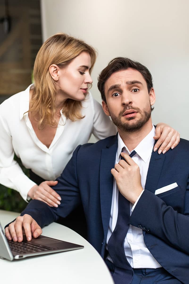 Woman lusting over a man in a business suit