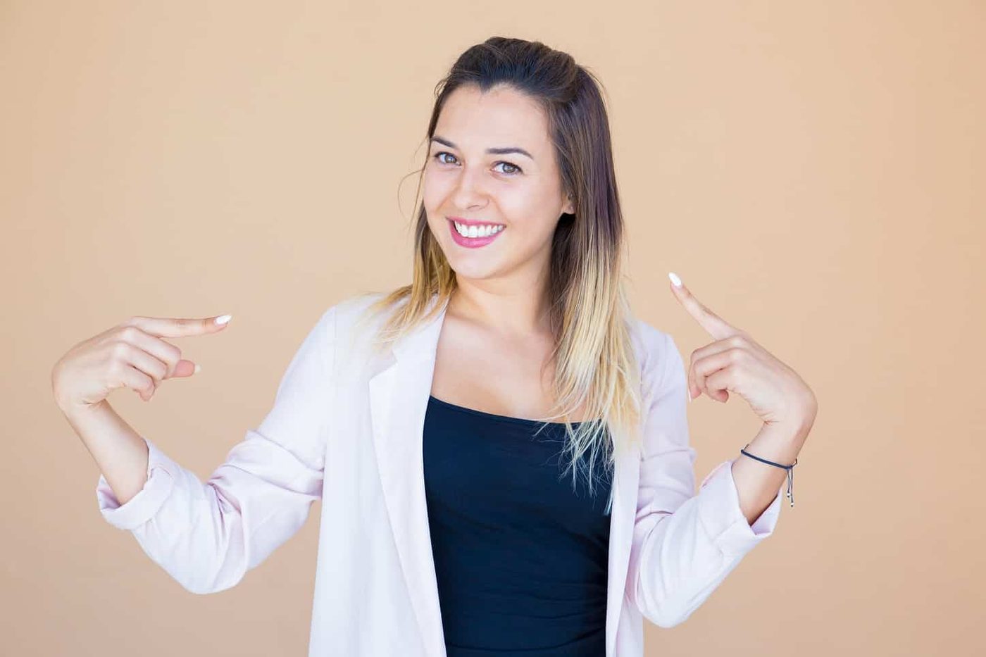 Cheerful pretty young woman proud of herself