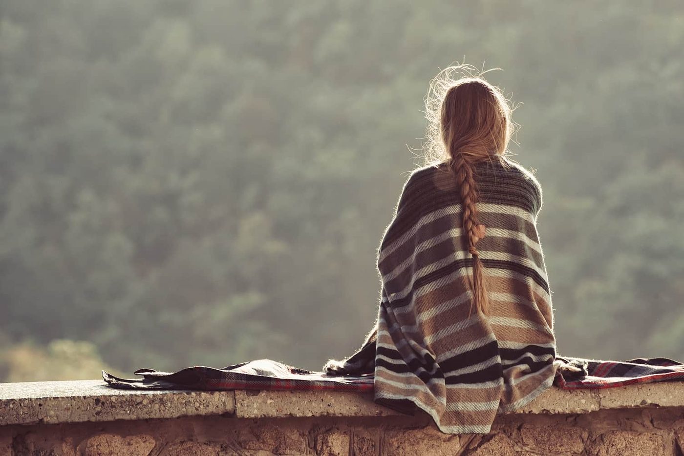 Woman alone in nature sad
