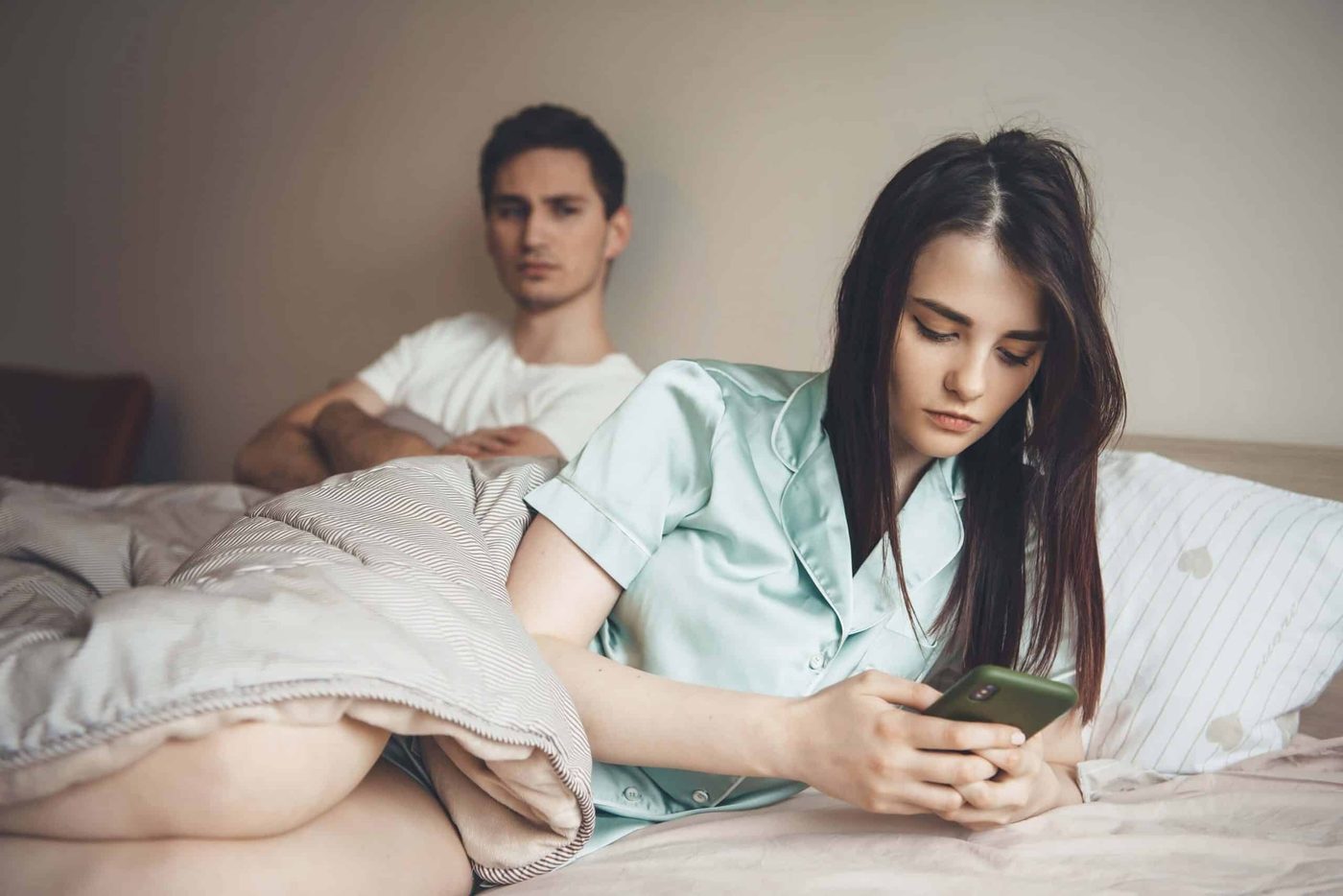 couple on bed jealous and angry
